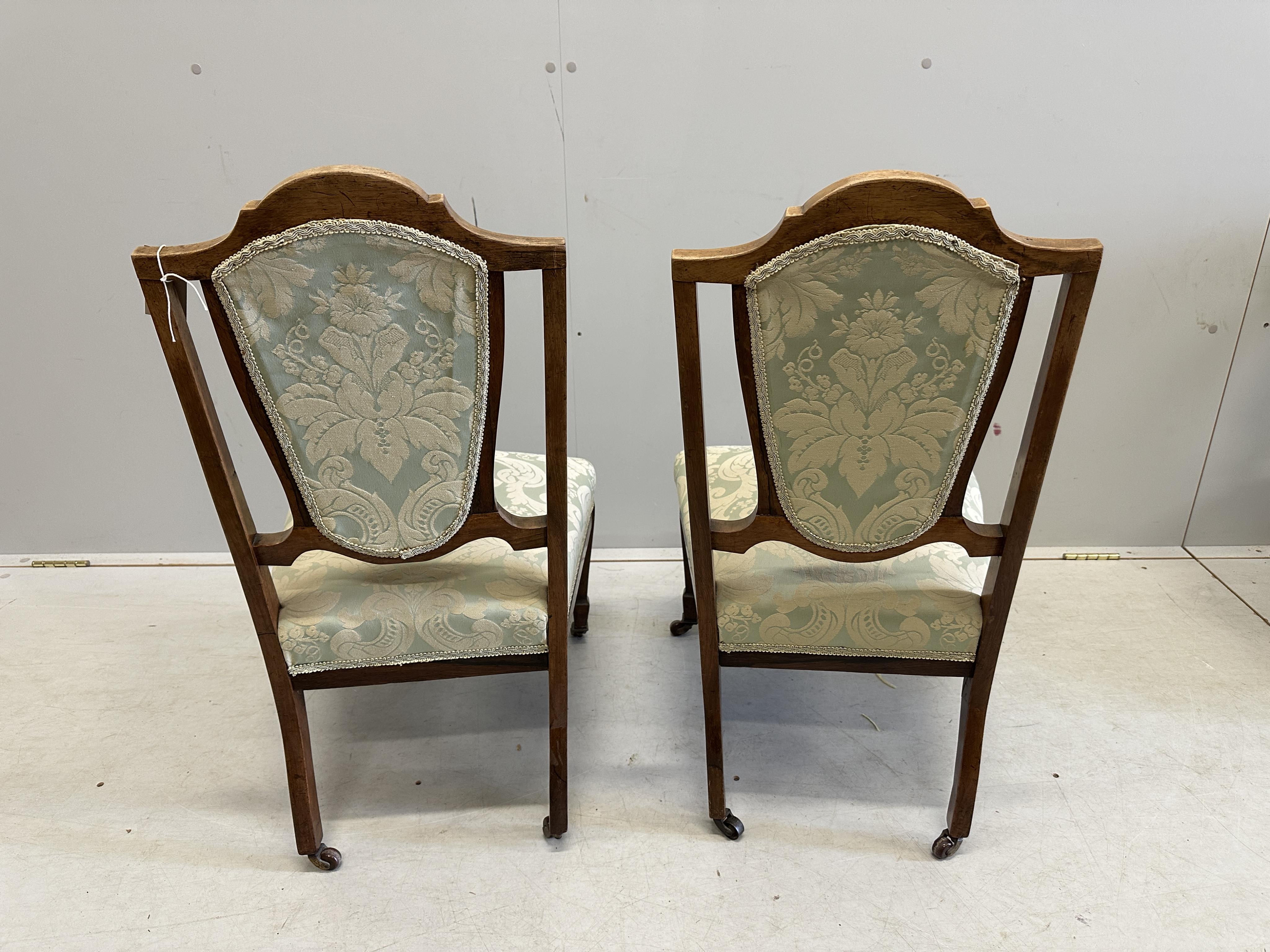 A pair of inlaid Edwardian salon chairs, a Victorian nursing chair and two others. Condition - fair